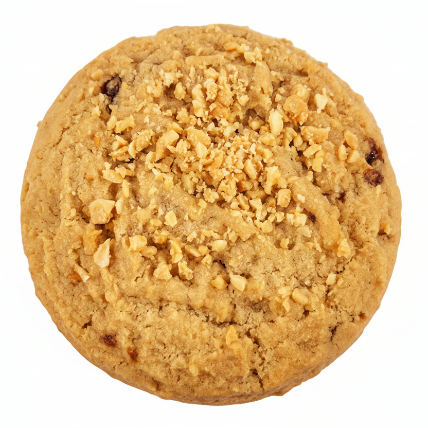 A single peanut butter toffee cookie topped with crushed peanuts. 